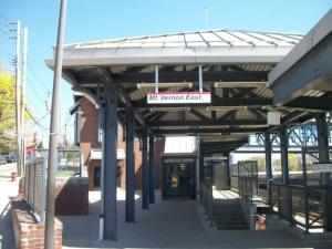 a train station with a sign that reads will terminal east at Urban Bedroom in Mount Vernon