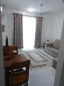 אזור ישיבה ב-Grey Pearl Apartments Where Raha is Also Our Priority