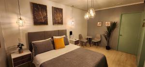 Postel nebo postele na pokoji v ubytování Hotel Voila la Moneda