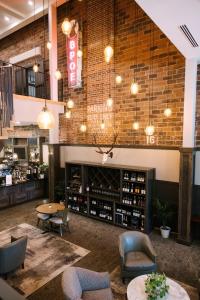 a wine tasting room with a brick wall at Hotel Windrow in Ellensburg