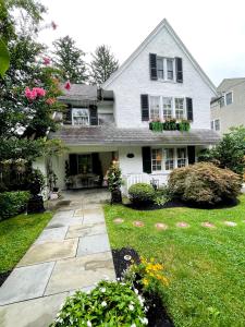 a house with a stone walkway in the yard at 9 Booth Lane in Haverford