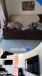 un soggiorno con un divano e una TV di Porto Home - AP 2 quartos a Porto Seguro