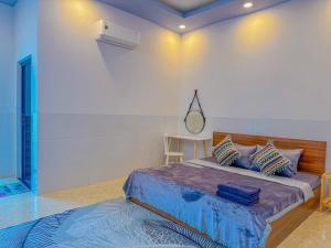 Postel nebo postele na pokoji v ubytování NHÂN TÂY 2 HOTELs