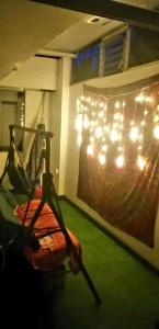 a room with a gym with a hammock and lights at Siren's House in Cusco