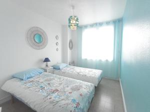 Posteľ alebo postele v izbe v ubytovaní Charmant 4 pièces à Sète avec balcon, proche plage, activités familiales et commodités - FR-1-338-509
