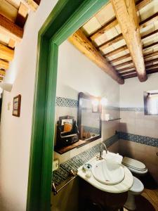 a bathroom with a sink and a toilet at Cortile Padre Vincenzo in Erice