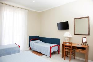 Postel nebo postele na pokoji v ubytování Terme Gorga Hotel + 25 fotografií