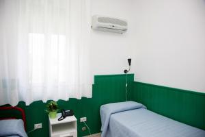 Postel nebo postele na pokoji v ubytování Terme Gorga Hotel