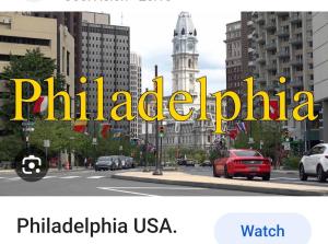 a sign that reads philadelphia in a city at Rustic Redlion Home 