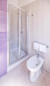 a bathroom with a shower and a toilet and a sink at B&B La Torre in Castellammare del Golfo