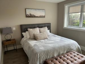 a bedroom with a large bed and a window at Luxury accomodation in West Vancouver in West Vancouver