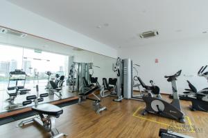 a gym with treadmills and cardio equipment in a building at SKS Pavillion Residences by Stayrene in Johor Bahru