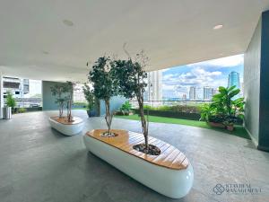 a room with a boat with trees in it at SKS Pavillion Residences by Stayrene in Johor Bahru