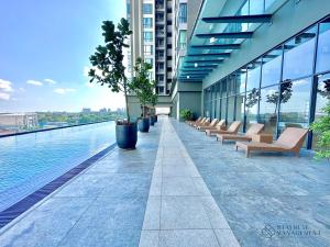 a row of benches on the side of a building at SKS Pavillion Residences by Stayrene in Johor Bahru