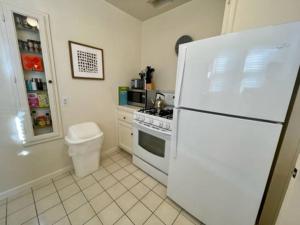 a kitchen with a white refrigerator and a stove at 1 bedroom house in Beverlywood/Carthay Square in Los Angeles