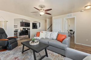a living room with a couch and a table at Massage Chair, Pool, Sleep Number Bed, Location in Meridian