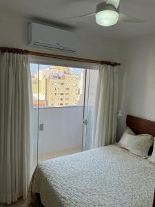 Ένα ή περισσότερα κρεβάτια σε δωμάτιο στο Aconchegante Pitangueiras - Ap. 1312 +14 φωτογραφίες