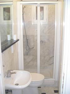 a bathroom with a shower and a toilet and a sink at Infinity view in Vernazza