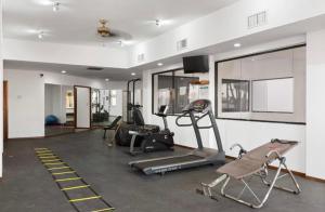 a gym with several exercise equipment in a room at New Built Condo minutes to Beach! in Puerto Peñasco