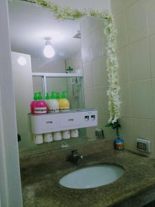 a bathroom with a sink and a mirror at Cheap 2BR Fully Furnished Condo in Davao City in Davao City