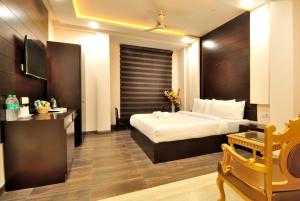 Postel nebo postele na pokoji v ubytování Hotel Kings Inn, Karol Bagh, New Delhi
