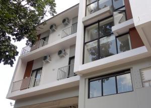 an apartment building with balconies and windows at LN9 Bandung Guest House in Bandung