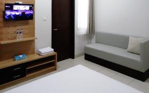 A television and/or entertainment centre at LN9 Bandung Guest House