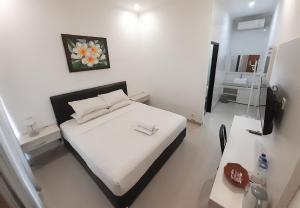 Postel nebo postele na pokoji v ubytování De Loran Hotel + 23 fotografií