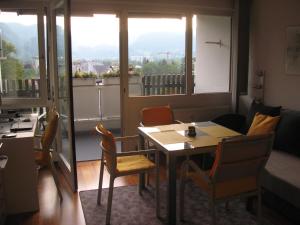a dining room with a table and chairs and a window at Ferienwohnung Zabel Appartement 5121 in Bad Reichenhall