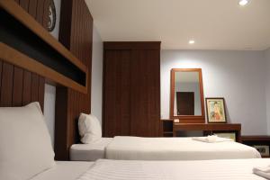 Letto o letti in una camera di The DEVA
