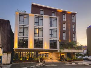 a large building with a lot of windows at Hotel Mokozoyo in George Town