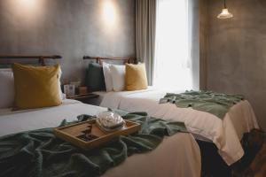 Postel nebo postele na pokoji v ubytování Hotel Mokozoyo