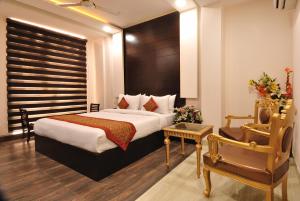 Postel nebo postele na pokoji v ubytování Hotel Kings Inn, Karol Bagh, New Delhi