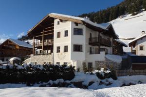 a house is under construction in the snow at Cedepuent de Sot in Selva di Val Gardena
