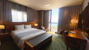 Postel nebo postele na pokoji v ubytování Best Louis Hamilton Hotel Haeundae