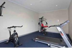 a gym with two exercise bikes in a room at Inner City Studio 501 in Toowoomba