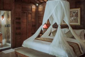 Postel nebo postele na pokoji v ubytování Portobello Villa Ubud