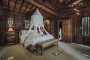 Postel nebo postele na pokoji v ubytování Portobello Villa Ubud