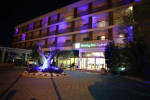 a building with purple lights in front of it at Holiday Inn Express Manisa-West by IHG in Manisa