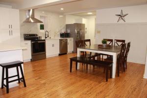 a kitchen and dining room with a table and chairs at Perfect home for families, groups, and gatherings in Atlanta