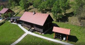an overhead view of a barn with a red roof at Tradicionalna zagorska drvena kuća Stara murva in Tuheljske Toplice