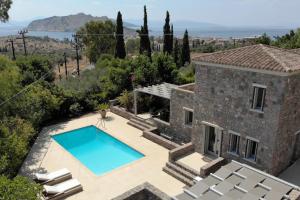 an image of a villa with a swimming pool at Miss Valentina-Modern Stone Villa in Aegina in Aegina Town