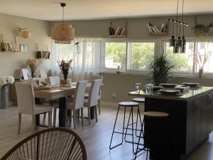 a kitchen and dining room with a table and chairs at Chez Flo in Avignon