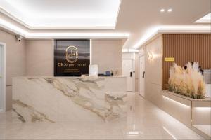 a lobby with a marble counter in a building at DK Incheon airport hotel in Incheon