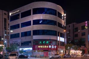 a large building in a city at night at DK Incheon airport hotel in Incheon