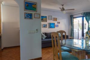 a living room with a table and a couch at Apartment Marzipans'Oasis in San Miguel de Abona