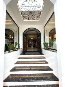 a building with a lobby with a glass ceiling at Hương Toàn 2 Hotel in Phu Quoc