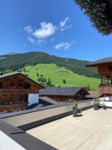 a view from the roof of a building with a green hill at Riverside in Alpbach