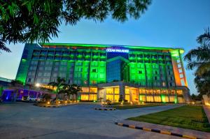 a large building with green lights on it at Ocean Paradise Hotel and Resort in Cox's Bazar