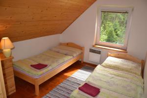 Postel nebo postele na pokoji v ubytování Chata Pohoda Slovenský Raj Čingov